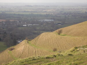 ST8412 : Child Okeford: walkers emerge on Hambledon Hill earthworks