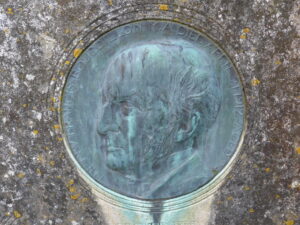 SU8722 : St James, Stedham: memorial to a former incumbent (B)