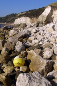 SY7681 : Boulders on the shore, Ringstead Bay